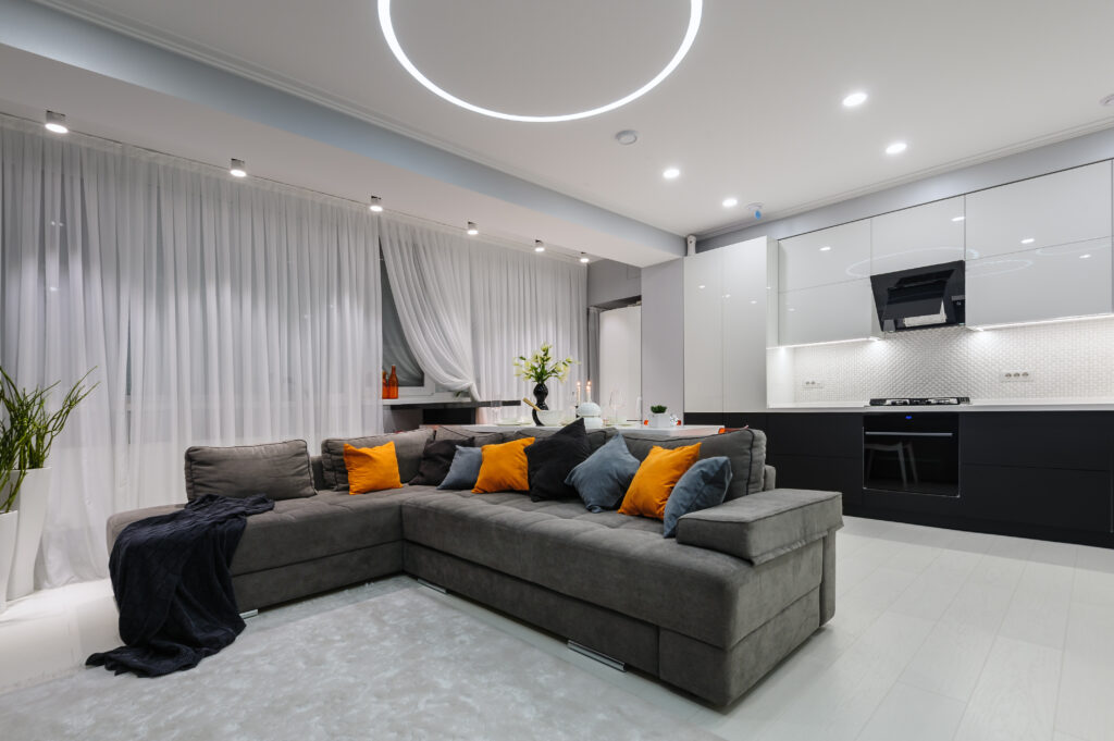 Modern designer white studio apartment, kitchen and living room toghether